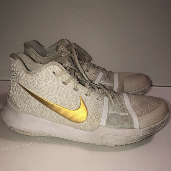 kyrie gold and white shoes